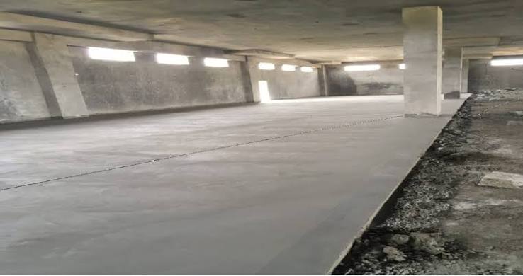Trimix flooring being laid and power trowelled at an industrial site